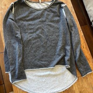 Cute funky cut up sweatshirt but super cozy and soft. Back has slits